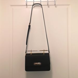 Structured crossbody top handle bag
